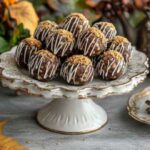 Butterfinger balls recipe on a vintage plate in a cozy Southern kitchen with warm light.