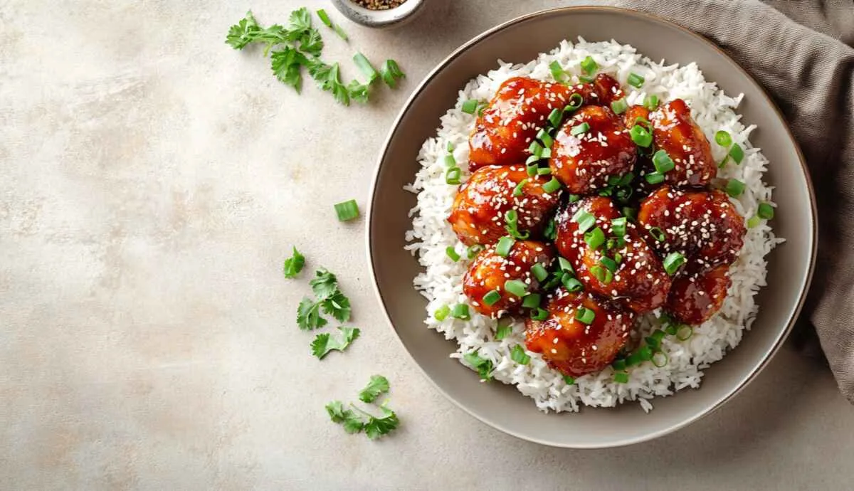 Irresistible sweet chili chicken served with rice and garnished with green onions
