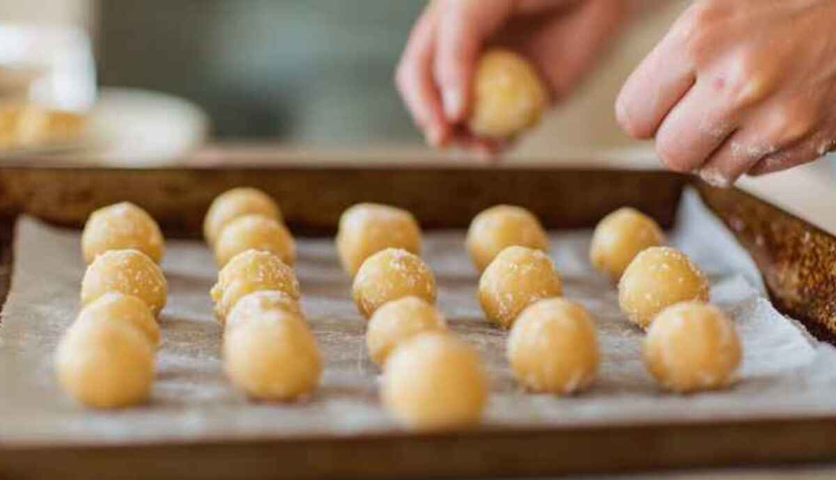 Rolling Butterfinger mixture into bite-sized balls